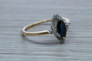 Marquise cut Halo set Blue Sapphire and Diamond Ring
