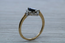 Load image into Gallery viewer, Marquise cut Halo set Blue Sapphire and Diamond Ring