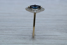Load image into Gallery viewer, Marquise cut Halo set Blue Sapphire and Diamond Ring