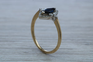 Marquise cut Halo set Blue Sapphire and Diamond Ring