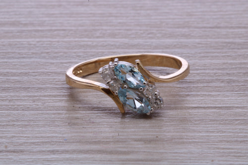 Sky Blue Topaz and Diamond set Yellow Gold Ring