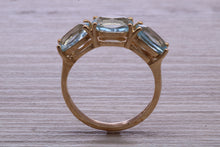 Load image into Gallery viewer, Sky Blue Topaz set Yellow Gold Twist Shank Ring