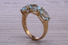 Load image into Gallery viewer, Sky Blue Topaz set Yellow Gold Twist Shank Ring