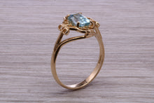 Load image into Gallery viewer, Swiss Blue Topaz set Yellow Gold Ring
