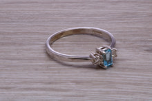 Load image into Gallery viewer, Petite Blue topaz and Diamond set White Gold Trilogy Ring