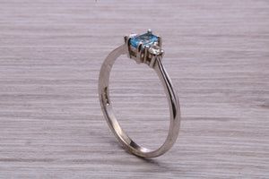Petite Blue topaz and Diamond set White Gold Trilogy Ring
