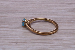 Dainty Sky Blue Topaz set Yellow Gold Ring