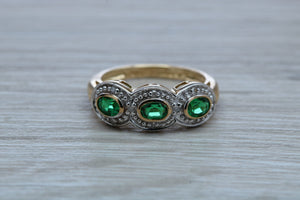 Three Emeralds and Diamonds set Yellow Gold Ring