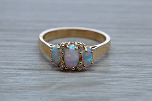 Fiery Opal and Diamonds set Yellow Gold Ring