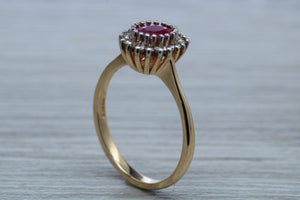 Oval cut Ruby and Diamond Cluster Ring
