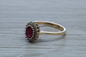 Oval cut Ruby and Diamond Cluster Ring