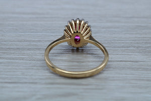 Oval cut Ruby and Diamond Cluster Ring