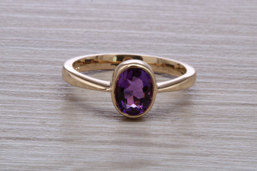 Oval cut Natural Amethyst set Yellow Gold Ring