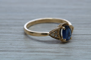 Oval cut Blue Sapphire and Diamond Ring