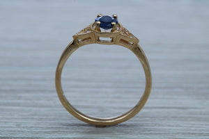 Oval cut Blue Sapphire and Diamond Ring