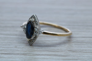 Marquise cut Halo set Blue Sapphire and Diamond Ring