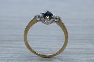 Marquise cut Halo set Blue Sapphire and Diamond Ring