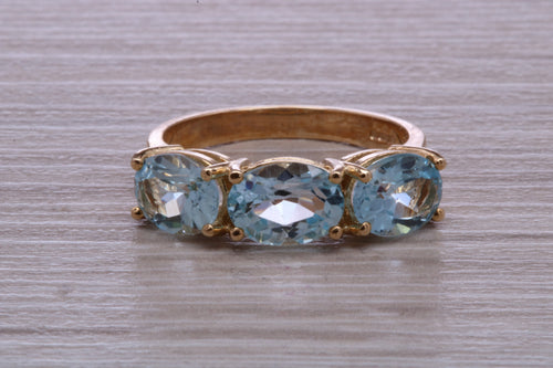 Sky Blue Topaz set Yellow Gold Twist Shank Ring