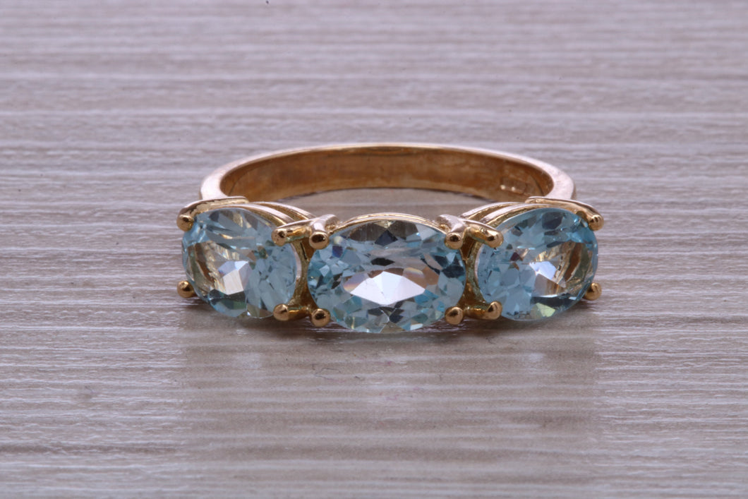 Sky Blue Topaz set Yellow Gold Twist Shank Ring