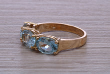 Load image into Gallery viewer, Sky Blue Topaz set Yellow Gold Twist Shank Ring