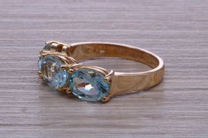 Sky Blue Topaz set Yellow Gold Twist Shank Ring