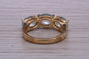 Sky Blue Topaz set Yellow Gold Twist Shank Ring