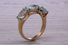 Load image into Gallery viewer, Sky Blue Topaz set Yellow Gold Twist Shank Ring