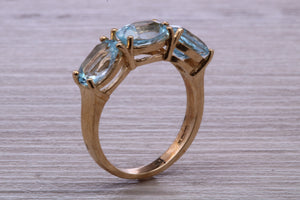 Sky Blue Topaz set Yellow Gold Twist Shank Ring