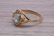 Load image into Gallery viewer, Swiss Blue Topaz set Yellow Gold Ring