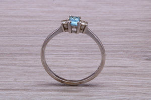 Petite Blue topaz and Diamond set White Gold Trilogy Ring
