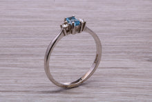 Load image into Gallery viewer, Petite Blue topaz and Diamond set White Gold Trilogy Ring