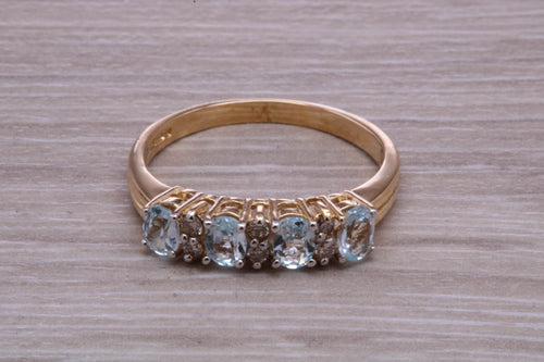 Sky Blue Topaz and Diamond set Yellow Gold Ring