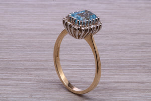 One carat Blue Topaz and Diamond set Yellow Gold Cluster Ring