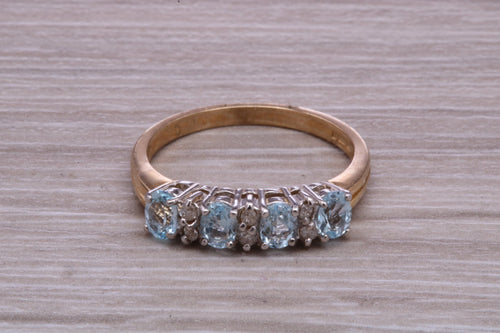 Sky Blue Topaz and Diamond set Yellow Gold Ring