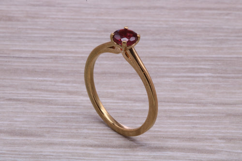 Quarter carat Rhodolite Garnet set Gold Solitaire Ring