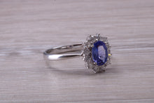 Load image into Gallery viewer, One and Half carat AAA Grade Tanzanite and Diamond Halo Ring