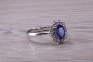 One and Half carat AAA Grade Tanzanite and Diamond Halo Ring