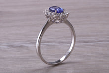 Load image into Gallery viewer, One and Half carat AAA Grade Tanzanite and Diamond Halo Ring