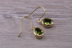 Natural Oval cut Peridot dropper earrings, set in solid 9ct Yellow gold