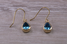 Load image into Gallery viewer, Tear Drop cut Swiss Blue Topaz Dropper Earrings set in Yellow gold