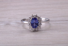Load image into Gallery viewer, One and Half carat AAA Grade Tanzanite and Diamond Halo Ring