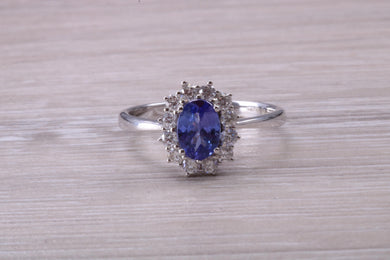 One and Half carat AAA Grade Tanzanite and Diamond Halo Ring