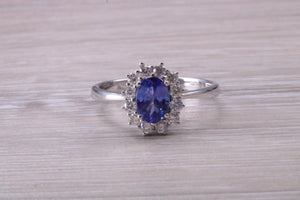 One and Half carat AAA Grade Tanzanite and Diamond Halo Ring