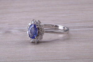 One and Half carat AAA Grade Tanzanite and Diamond Halo Ring