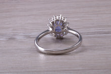 Load image into Gallery viewer, One and Half carat AAA Grade Tanzanite and Diamond Halo Ring