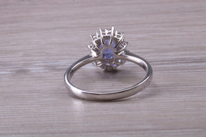 One and Half carat AAA Grade Tanzanite and Diamond Halo Ring