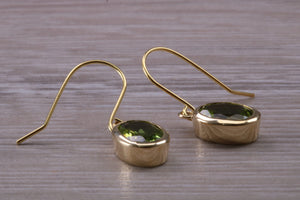 Natural Oval cut Peridot dropper earrings, set in solid 9ct Yellow gold
