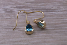 Load image into Gallery viewer, Tear Drop cut Swiss Blue Topaz Dropper Earrings set in Yellow gold