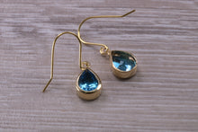 Load image into Gallery viewer, Tear Drop cut Swiss Blue Topaz Dropper Earrings set in Yellow gold