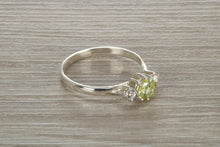 Load image into Gallery viewer, Sterling Silver Peridot C Z Trilogy Ring